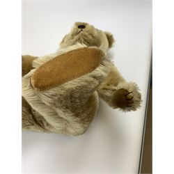 Chiltern Hugmee large teddy bear c1950s with kapok filled long-plush body, jointed swivel head with original orange and black glass eyes and vertically stitched nose and mouth, jointed limbs with card lined feet and velvet covered pads and inoperative squeaker H22