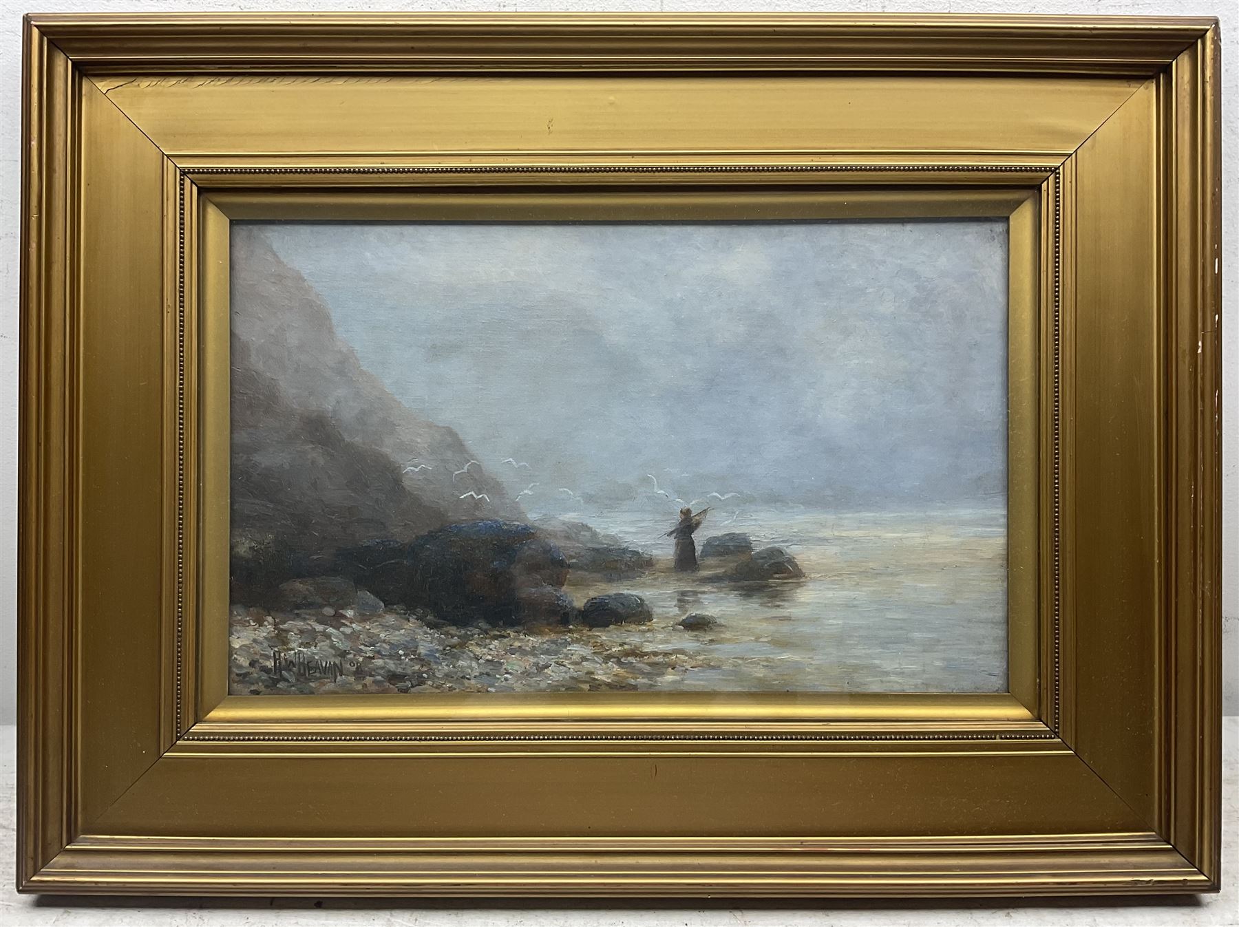 H W Beavan (British Early 20th century): Sailing Boats Moored in Whitby Harbour and Angler on Whitby Shore, pair oils on canvas signed one dated '08, 24cm x 39cm (2)