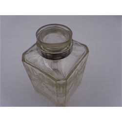Early 20th century French silver mounted glass scent bottle, the faceted rectangular glass body etched with swags of flowers united by ribbons, with cylindrical silver cover embossed with foliate detail and beaded decoration with gilt interior, marked with Minerva's head, with white metal collar and glass stopper, H17cm