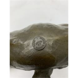A bronze figure, modelled as a cougar in crouching pose, signed Milo and with foundry mark, L40cm.
