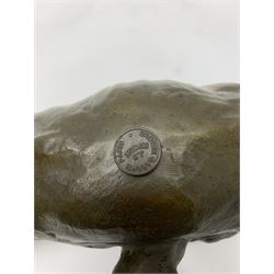 A bronze figure, modelled as a cougar in crouching pose, signed Milo and with foundry mark, L40cm.
