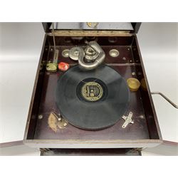 Early 20th century wind up gramophone set in a wooden case with twin door sound hole to the front and tins of 'His Masters Voice' needles