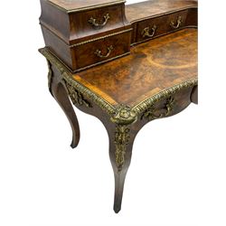 Late 19th to early 20th century French figured walnut writing desk, raised back fitted with drawers, shaped top with Kingwood banding and foliage cast edge moulding, fitted with single drawer, on cabriole supports mounted by shell and flower head cartouches 