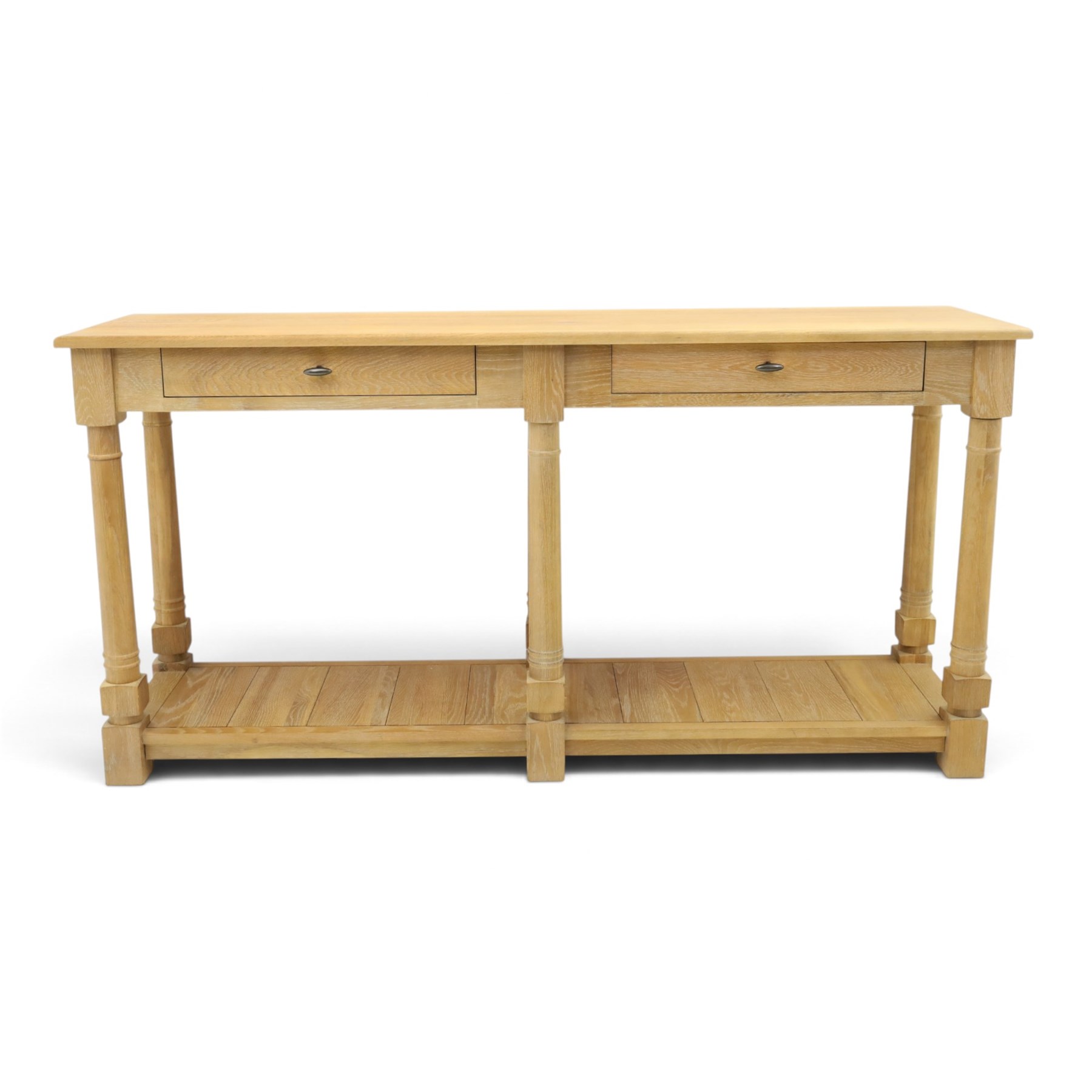 Neptune - 'Edinburgh' limed oak console table, with two
soft close drawers raised on ring-turned column supports,
with a pot shelf raised on square feet