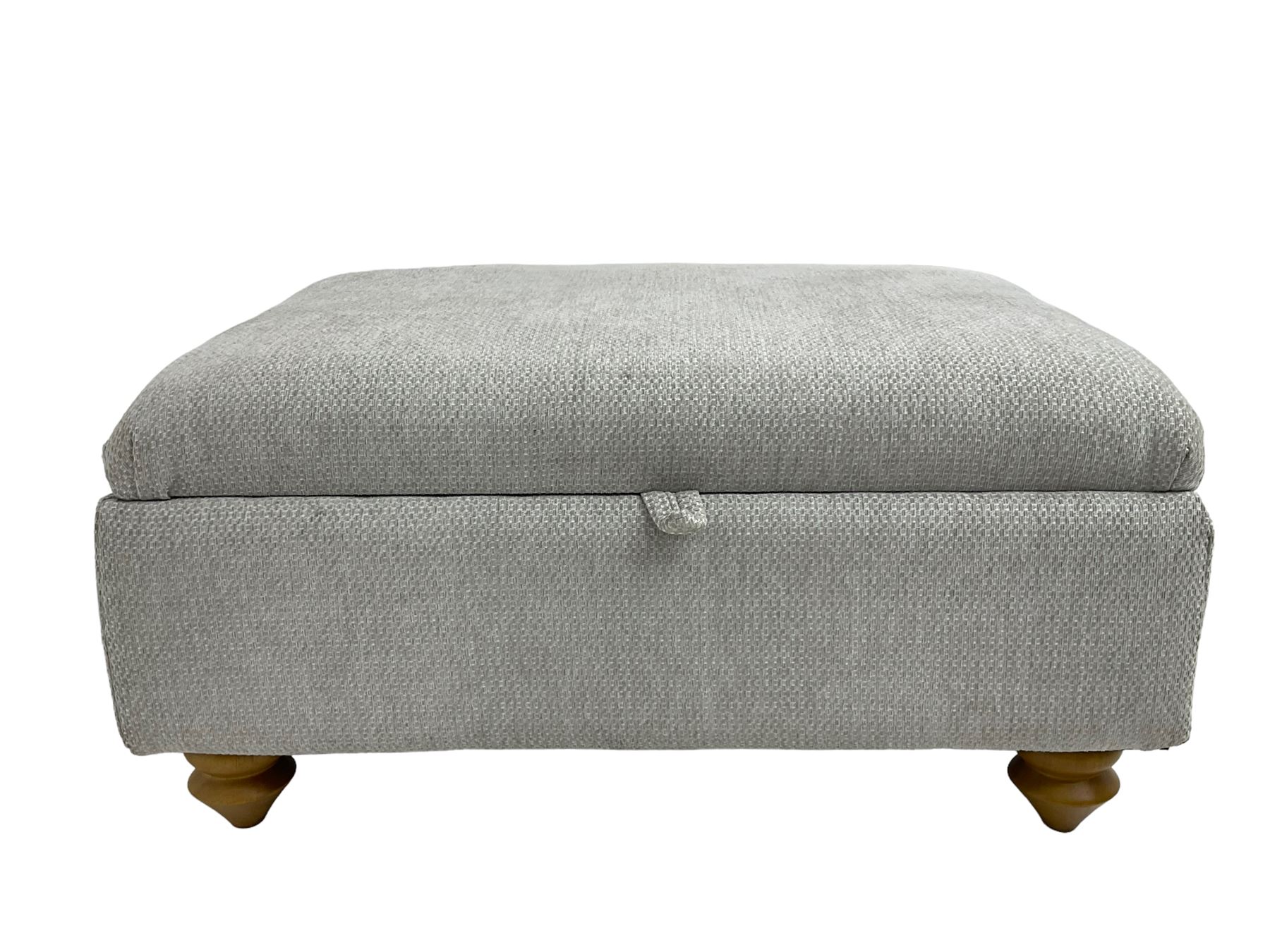 Oak Furnitureland - 'Gainsborough' lounge suite - three seat sofa, out-swept arms with loose cushions on turned oak feet, upholstered in 'Minerva Silver' fabric (W209cm D102cm H80cm); matching armchair or snuggler settee (W125cm); and rectangular ottoman footstool