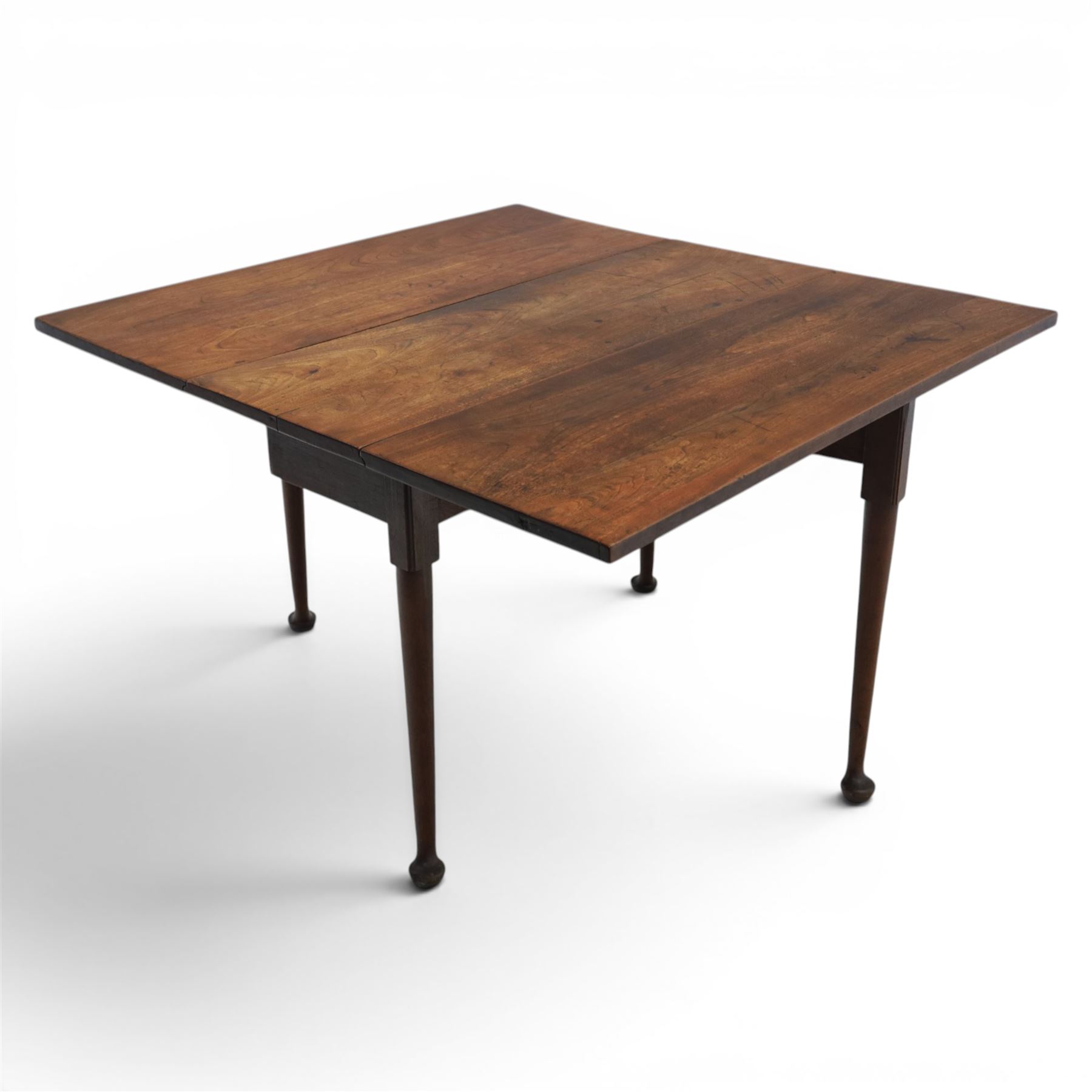 18th century solid walnut drop leaf table, with gate legs terminating in pad feet