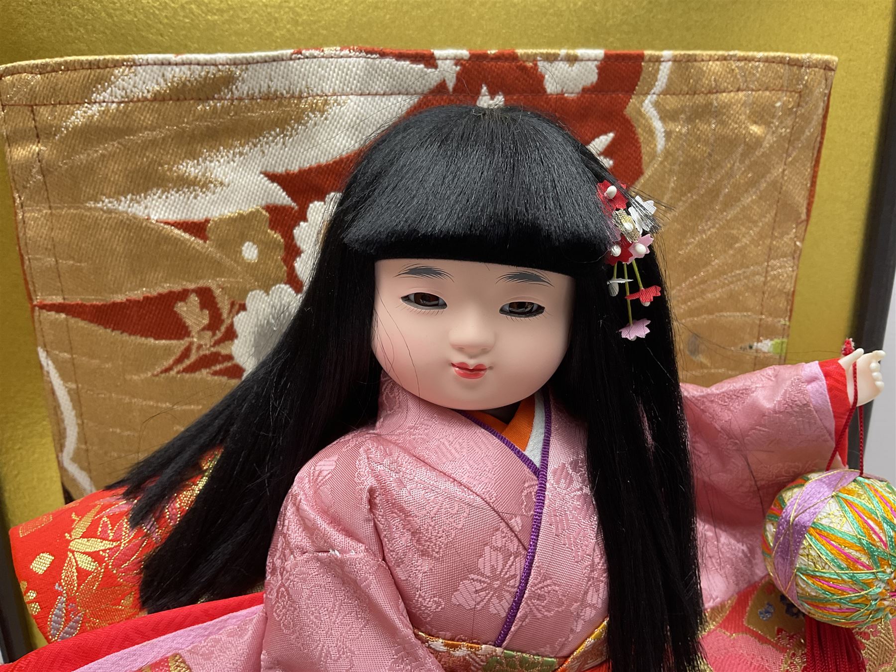 Japanese doll, dressed in traditional Japanese dress, within wooden glazed box, box H40cm