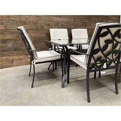 Metal framed garden table with glazed top (W170cm, D102cm, H71cm) and six armchairs with cushions 
