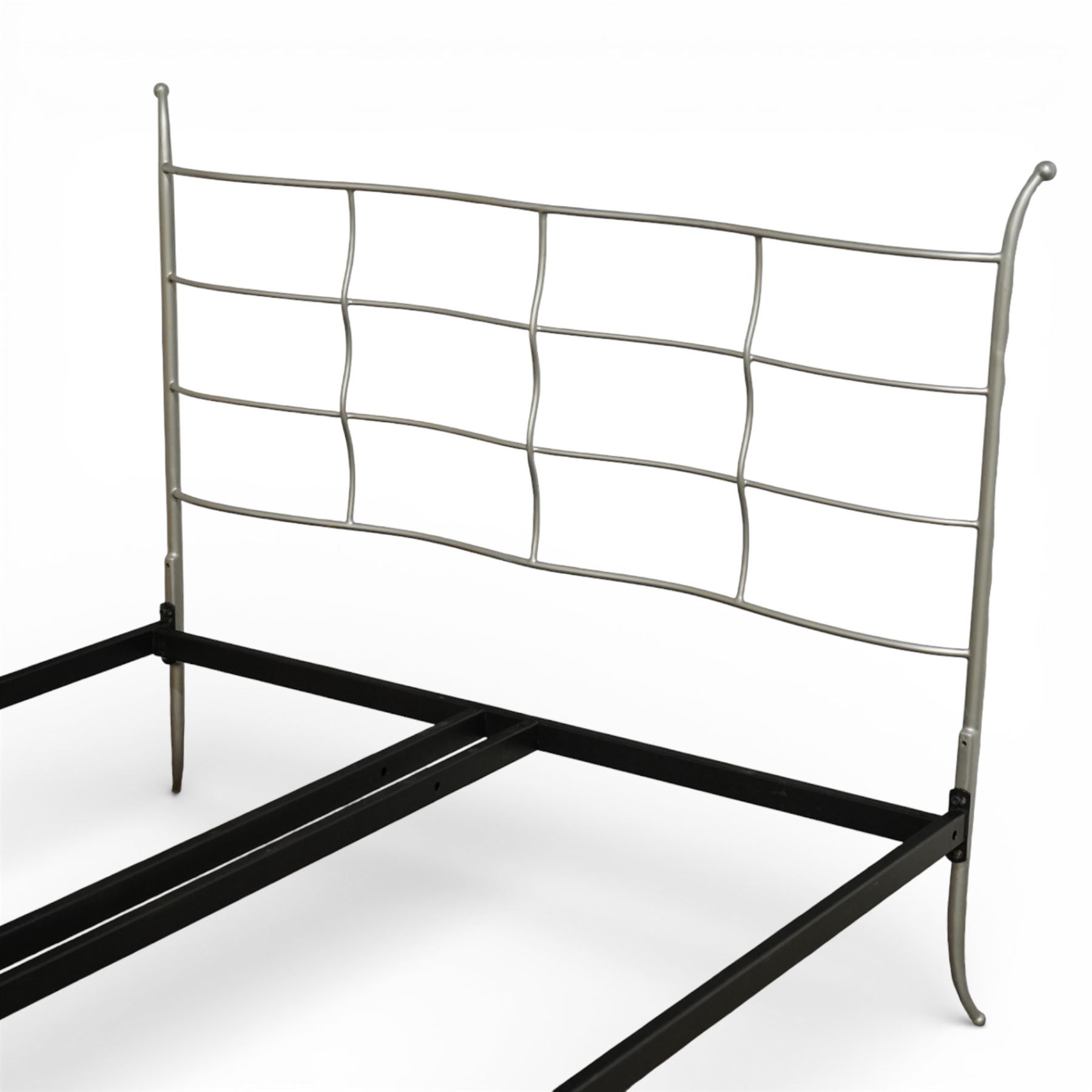 And So To Bed - ‘Verdi’ king size bed, with metal headboard and footboard formed with undulating silver painted metal horizontal bars and shaped uprights, on a black metal bed frame,