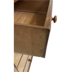 Early 20th century figured walnut chest, fitted with two short over three long drawers with bookmatch veneer facias, each with turned walnut handles, skirted base over compressed bun feet 