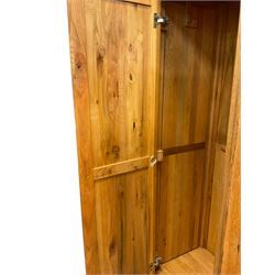 Oak double wardrobe, fitted with two panelled doors enclosing hanging rail