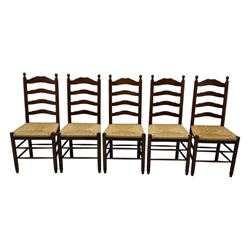 Set of ten 18th century design oak ladder back dining chairs, shaped cresting rail over four horizontal splats, rush seat raised on turned supports united by double stretchers