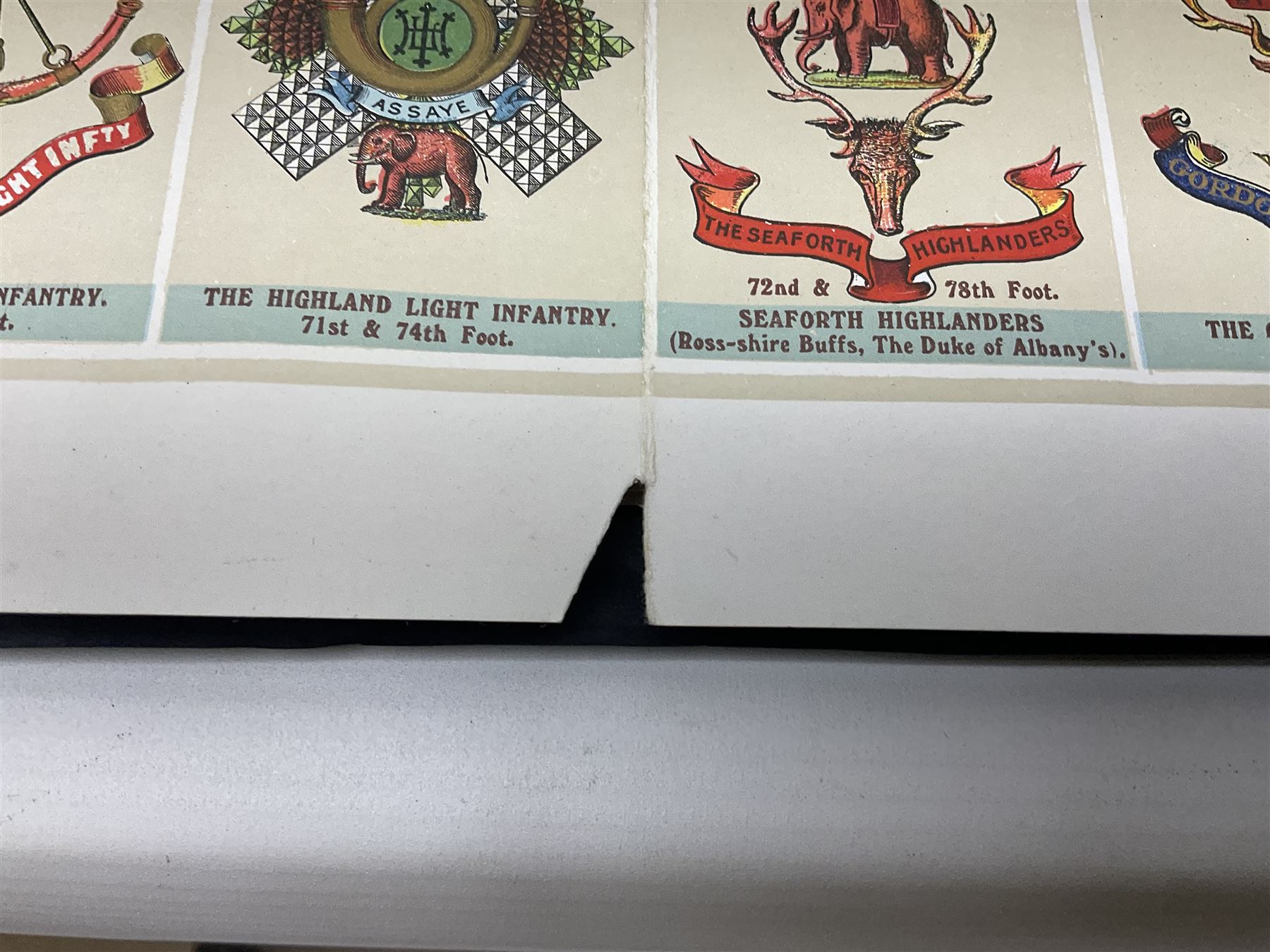 Large poster entitled 'Crests and Badges of the British Army in Daily Use 56 x 86cm; together with twenty-five colour prints of military interest including Crimean War, Boer War, WW2 etc; various sizes; all unframed