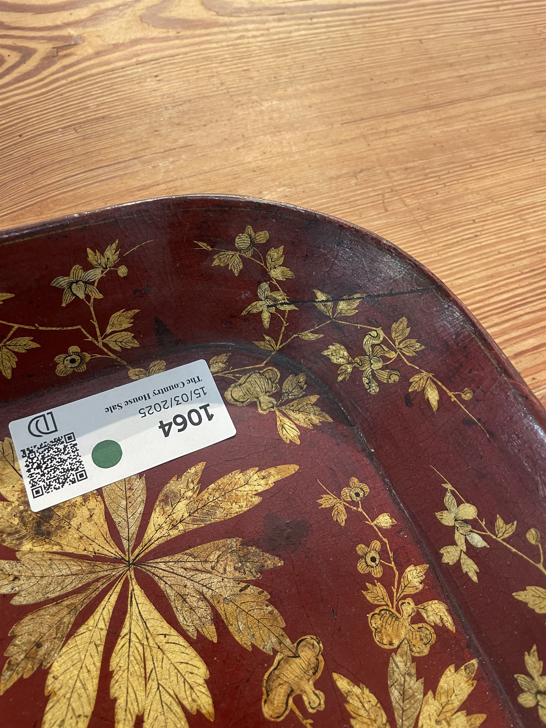 Early 19th century red lacquered papier-mâché tray by Clay of King Street Covent Garden, of rounded rectangular form, painted in gilt with large foliate sprays and butterflies, impressed verso CLAY KING ST COVENT GARDEN, W66.5cm D48.5cm