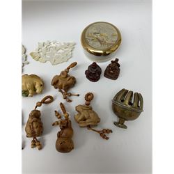 Japanese carved wood netsukes modelled as animals to include rabbit and bear with beaded strings, two Buddha figures, mother of pearl panels carved with birds and foliage, jadeite necklaces, brass bell etc