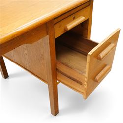 Abbess Woodwork Company - Mid  20th century solid oak single pedestal desk, rounded rectangular top with single pedestal, oak pull handles with fitted slide, above a drawer with cutlery divider, over a double height drawer, square tapering supports united by stretchers