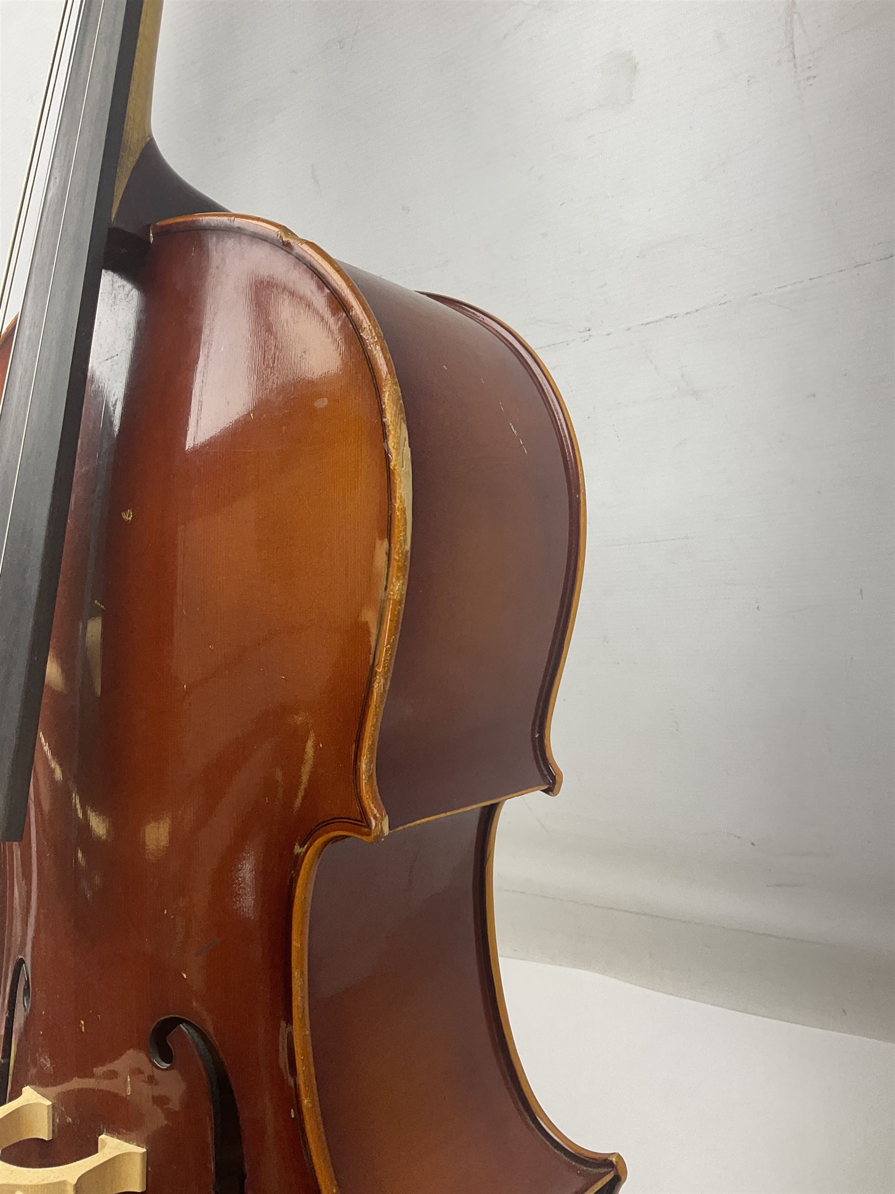 Two student half-size cellos - Boosey & Hawkes Artia with 65cm one-piece back and spruce top; bears maker's label; L104cm overall; and Romanian with 65.5cm two-piece maple back and ribs and spruce top; bears label; L108.5cm overall; each in soft carrying case with two bows (2)
