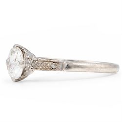 Early 20th century platinum diamond ring, four claw set with a single old cut diamond of approx 0.90 carat and diamond set shoulders, stamped Plat, inscribed with initials and dated 7.6.28