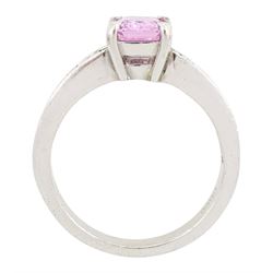Platinum pink sapphire and diamond ring, single octagonal cut sapphire of approx 1.50 carat, each shoulder set with eleven, channel set baguette cut diamonds, London 2007, total diamond weight approx 1.05 carat