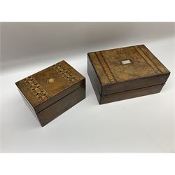 Late 19th century walnut box of hinged rectangular form with bands of geometric inlay, together with a similar larger example with mother of pearl inlaid panel, largest W30cm H13cm D23cm