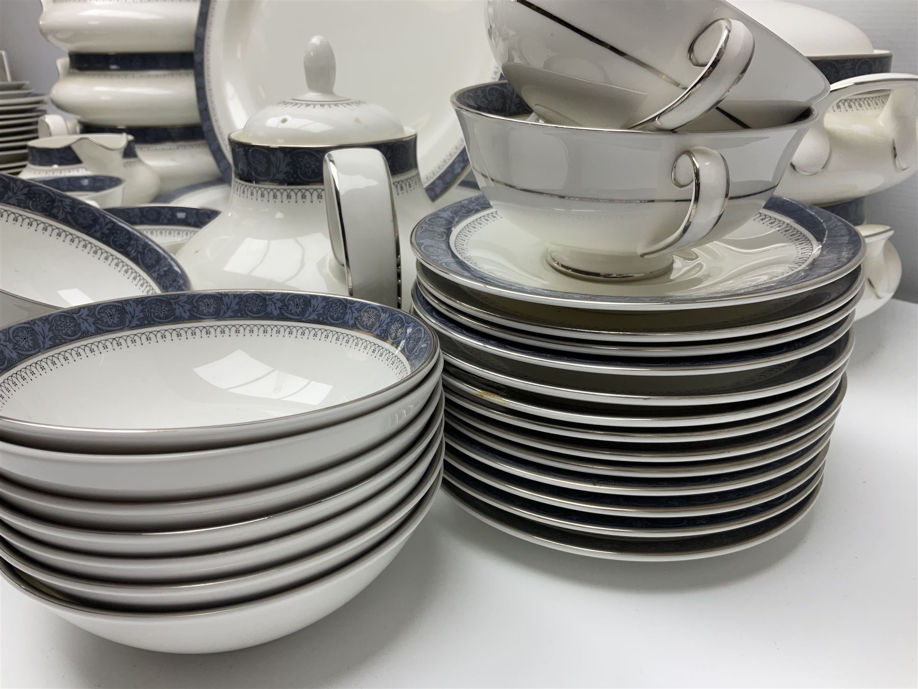 Royal Doulton Sherbrooke pattern part dinner and tea service, to include teapot, ten twin handled soup bowls and saucers, two serving platters, three twin handled covered dishes etc (63)  