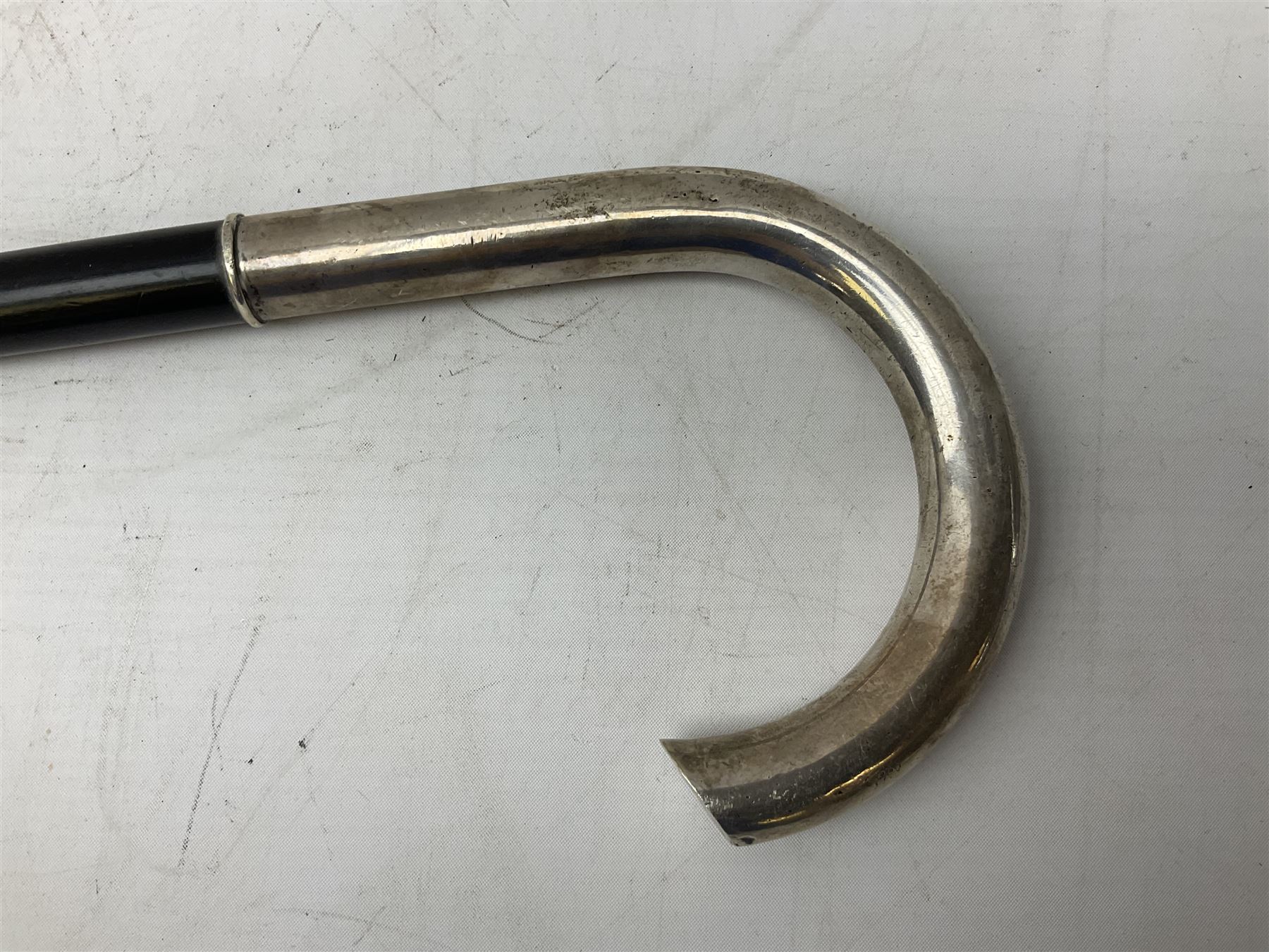 Continental silver handled walking cane, unmarked but testing around 800 standard, with engraved monogram to terminal, upon an ebonised cane, approximately H91.5cm