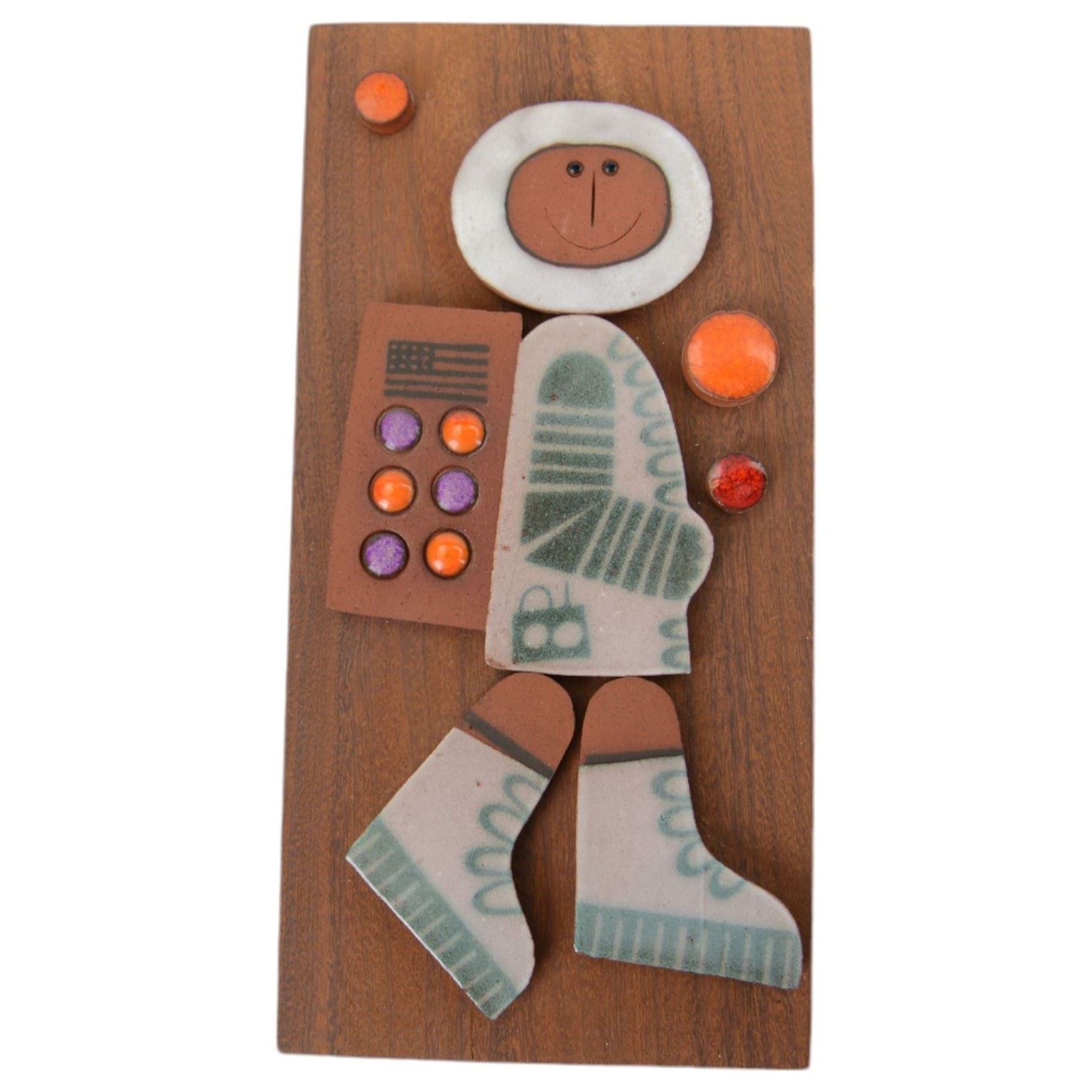 Three Hornsea Muramic handcrafted wall plaques, comprising Spaceman, Jester and Maharajah on Elephant, designed by John Clappison, H21cm, W10cm