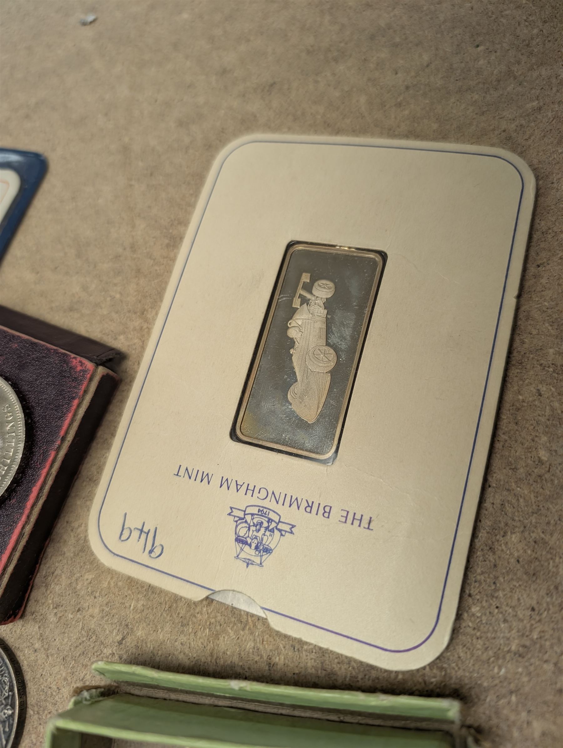 The Birmingham Mint International Formula 3 silver ingot, hallmarked, pair of sovereign scales, two silver fobs and others, etc and a collection of Great British coins