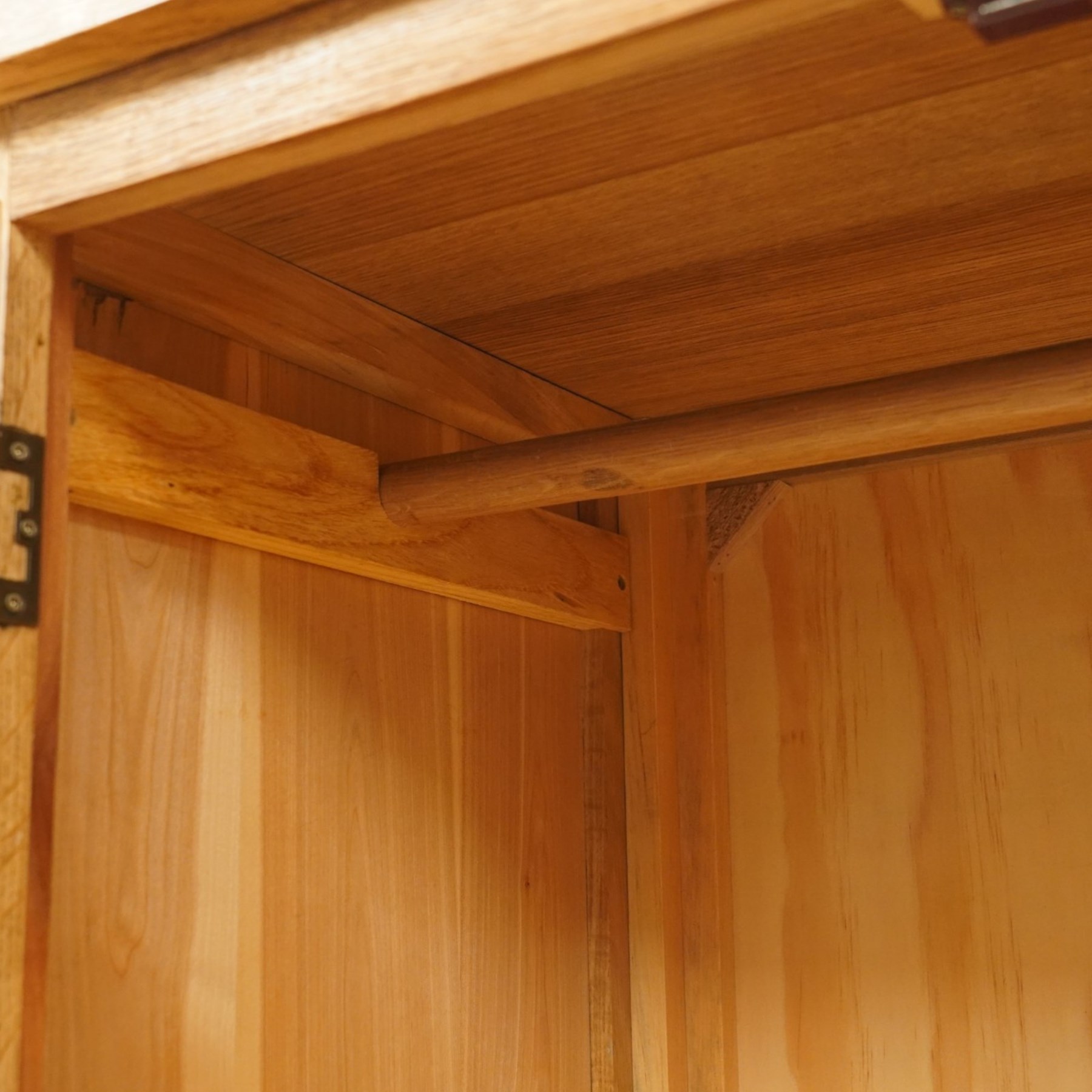 Contemporary light oak double wardrobe, fitted with two panelled cupboards over single drawer