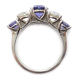  Silver tanzanite and white topaz hinged bangle and similar five stone ring, both stamped 925   