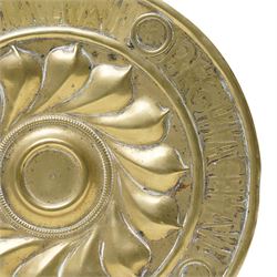 Central section of a 17th century Nuremberg brass alms dish, central rosette surrounded by Gothic inscription, intersected by roundels with engraved heads, D23cm 