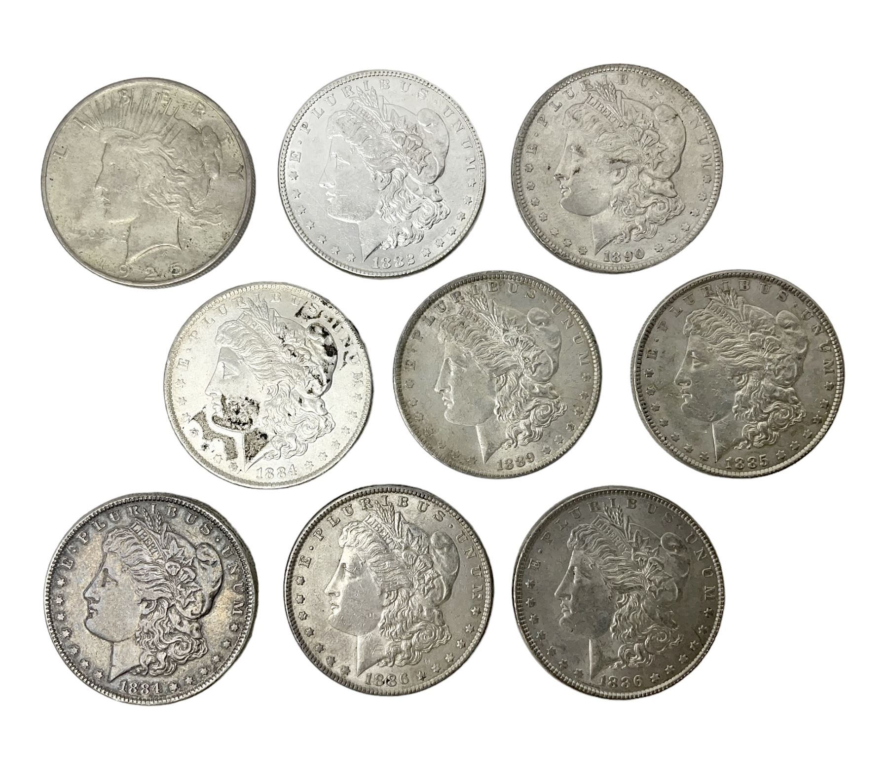 Eight United States of America silver Morgan dollar coins, dated 1882, 1884 O, 1884, 1885, two 1886, 1889, 1890 and a 1925 peace dollar