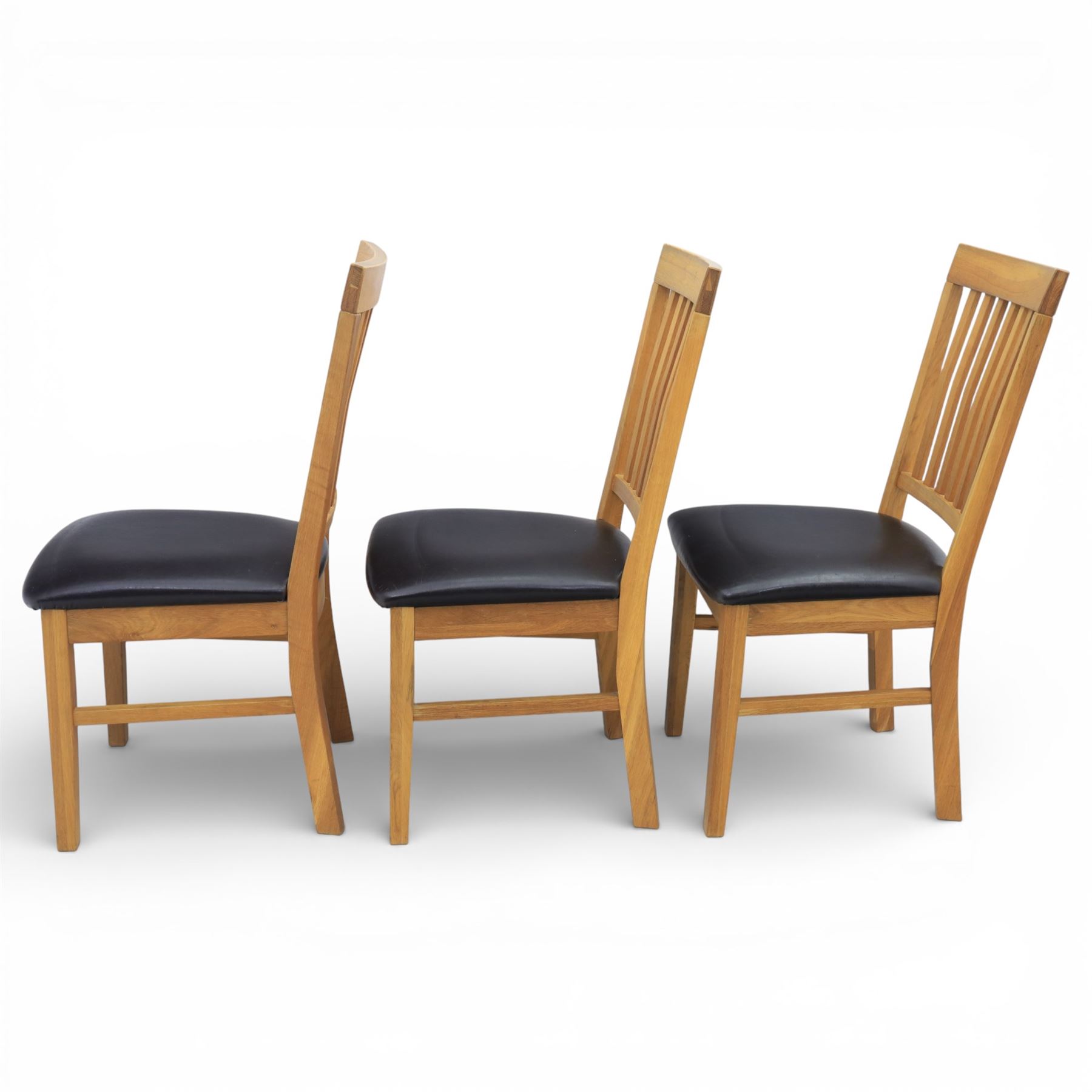 Solid light oak extending dining table with single leaf, and set of six chairs