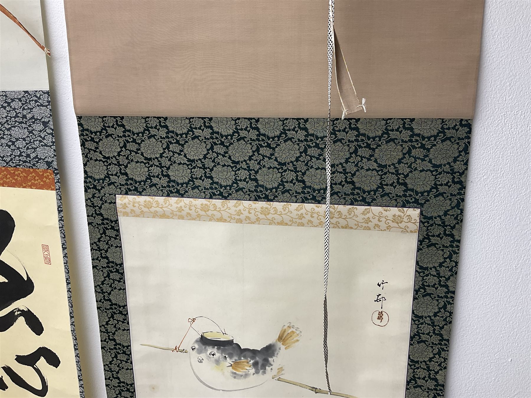 Two 20th century Japanese kakemono, the first example depicting a puffer fish, the second with Japanese Calligraphy 