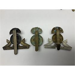 Nineteen Yeomanry metal cap badges including Derbyshire, Northamptonshire, Essex, Glamorgan, Staffordshire, City of London, Surrey, Shropshire, Hertfordshire etc; together with eleven Fusiliers badges including Lancashire, Royal Welch, Northumberland etc (30)