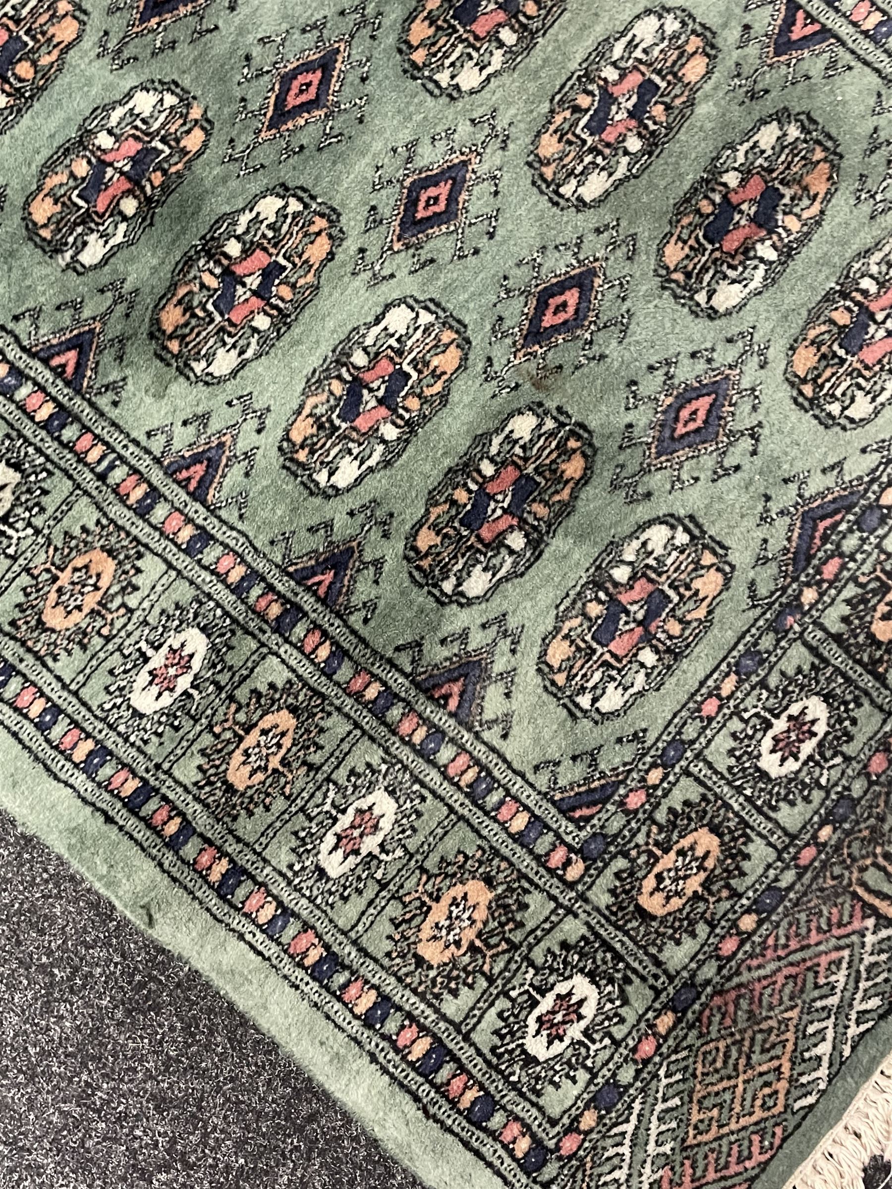 Persian Tekke Bokhara green ground runner rug 
