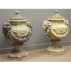  Pair of stone octagonal Garden Urns, the covers dated 1870, bodies with carved rams heads joined by oak leaf and acorn garland, on stepped tapering bases, possibly Coade Stone, H94cm (2)  