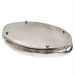Silver plated oval gallery tray with pierced border and gadrooned edge with integral handles L63cm