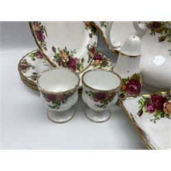 Royal Albert Country Roses pattern part tea and dinner service, to include teapot, four cups and saucers, four dessert plates, cake plate etc, (41)