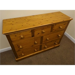  Pine chest, moulded top,three short and four long drawers, platform base, W142cm, H102cm, D45cm  