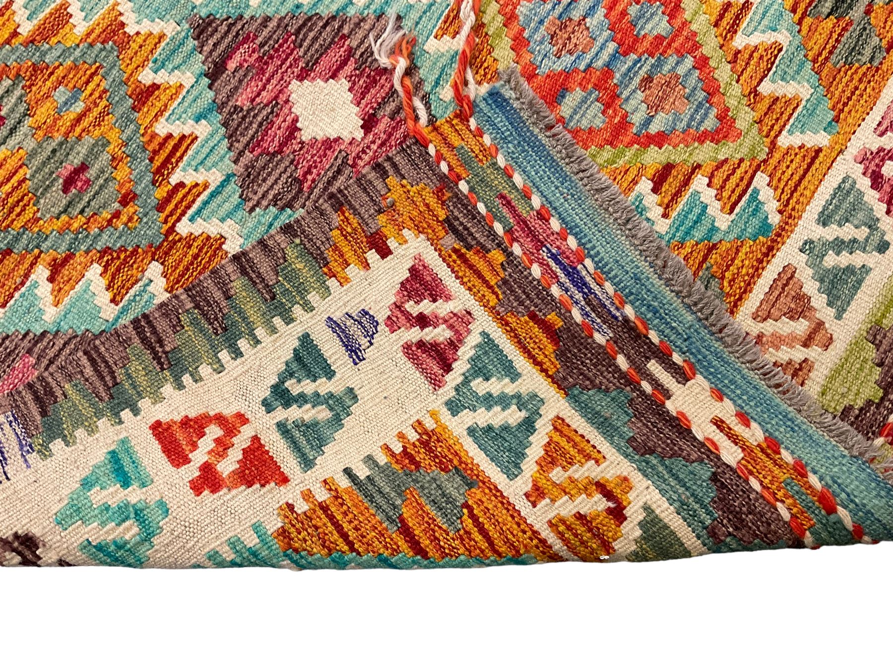Anatolian Turkish Kilim multi-colour rug, decorated with all over lozenges in contrasting colours with ivory outline, the multi-band ivory border with repeating geometric shapes and small lozenges or diamonds