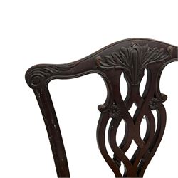 Set of eight (6+2) early 20th century Chippendale design mahogany dining chairs, shaped cresting rail over pierced interlocking splat with carved foliate and scrolling decoration, drop-in tan leather upholstered seats, over moulded gadrooned apron, raised on cabriole supports with acanthus carved knees and ball and claw carved terminals