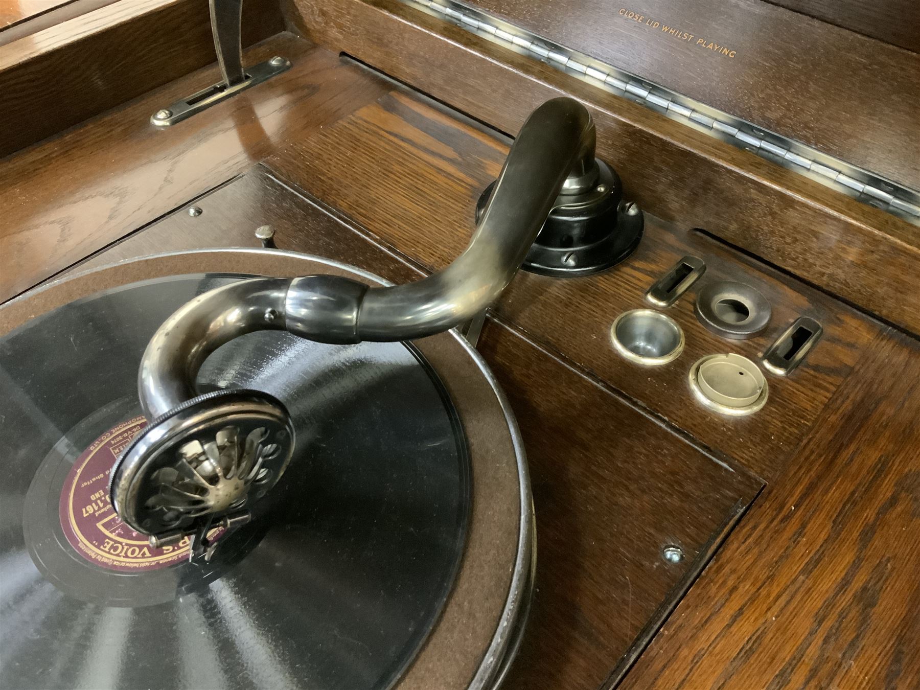 Early 20th century ‘HMV' 202 cabinet gramophone, oak cased, moulded top with foliate carved moulding hinges to reveal gramophone, two doors enclosing horn, on turned supports joined by moulded stretcher rails