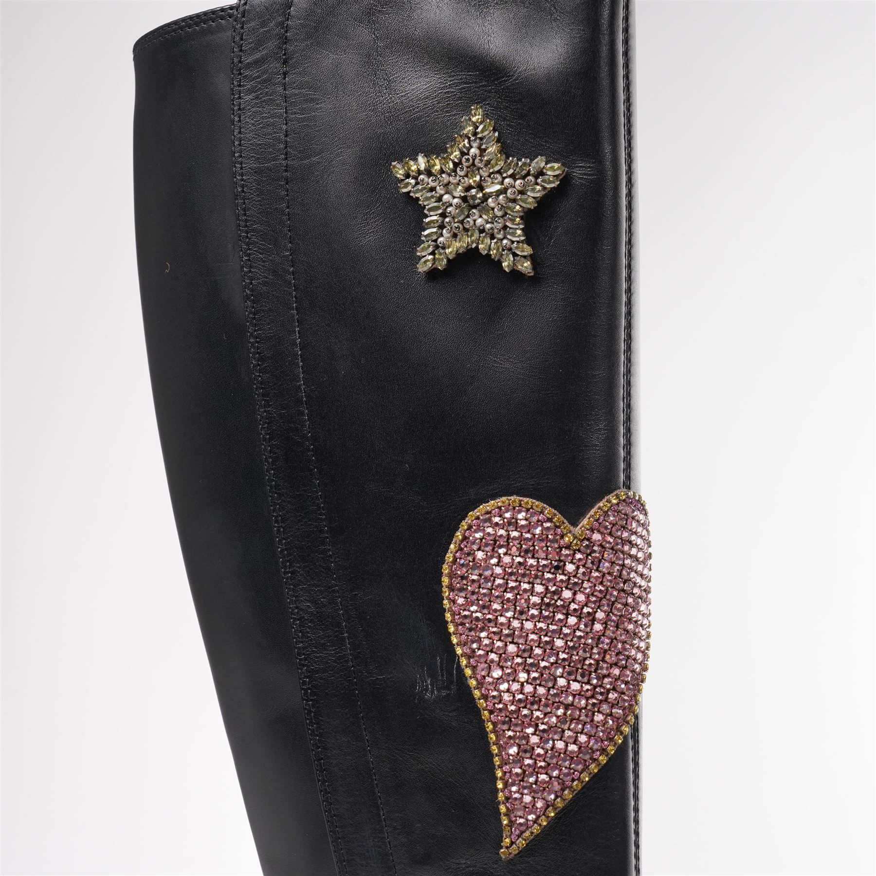 Gucci - pair of Dionysus buckled knee-high leather boots, in black with block heels, applied with rhinestone star, moon and heart applique motifs, with the signature silver tone tiger head buckle fastening and full length zip, size 38, total boot height 48cm, unused with original box and dust bags