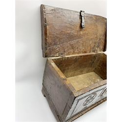 17th/18th century boarded oak plank box, the hinged lid with front mould, the front with iron lock carved with star motifs, upon sledge supports, H28cm W55cm D28cm