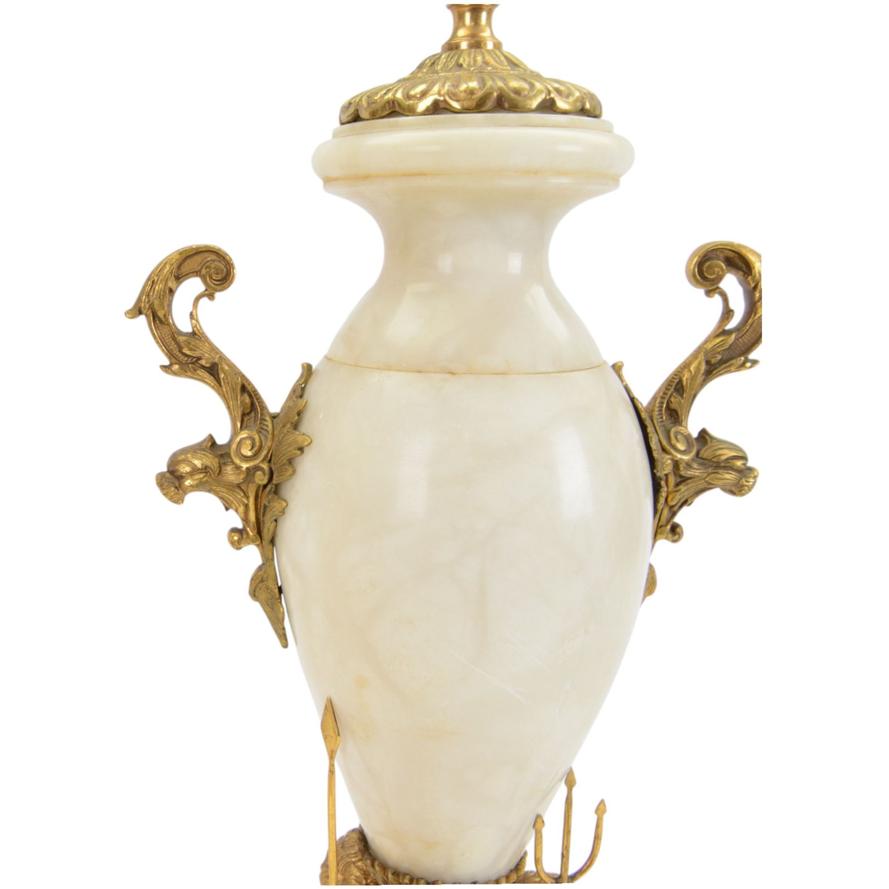 Onyx table lamp, of urn form with scrolling gilt handles, the stepped circular base adorned with three seated putti, H60cm