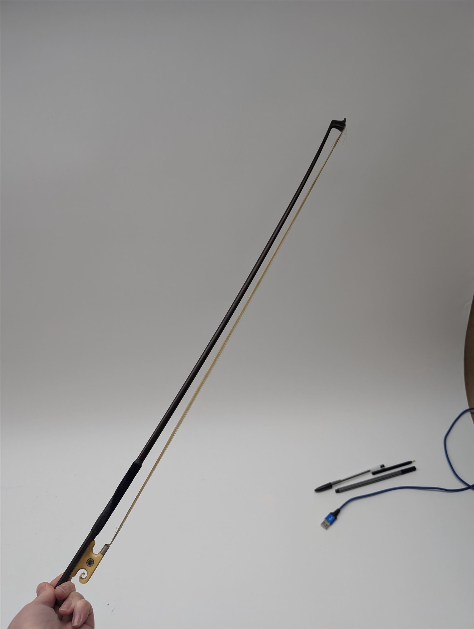 Late 19th century full size German violin with a  Wolff Brothers label, scroll with ebony pegs, finger board and tail piece, in a hard case with bow. Length 60cm

This item has been registered for sale under Section 10 of the APHA Ivory Act