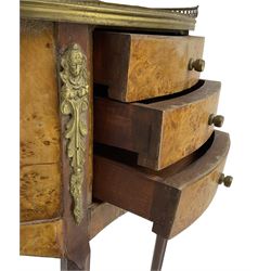 Late 20th century French design figured elm and bedside table, raised pierced gilt metal gallery over oval top, fitted with three mahogany lined drawers flanked by gilt metal mounts of female mask and foliate form, on cabriole supports