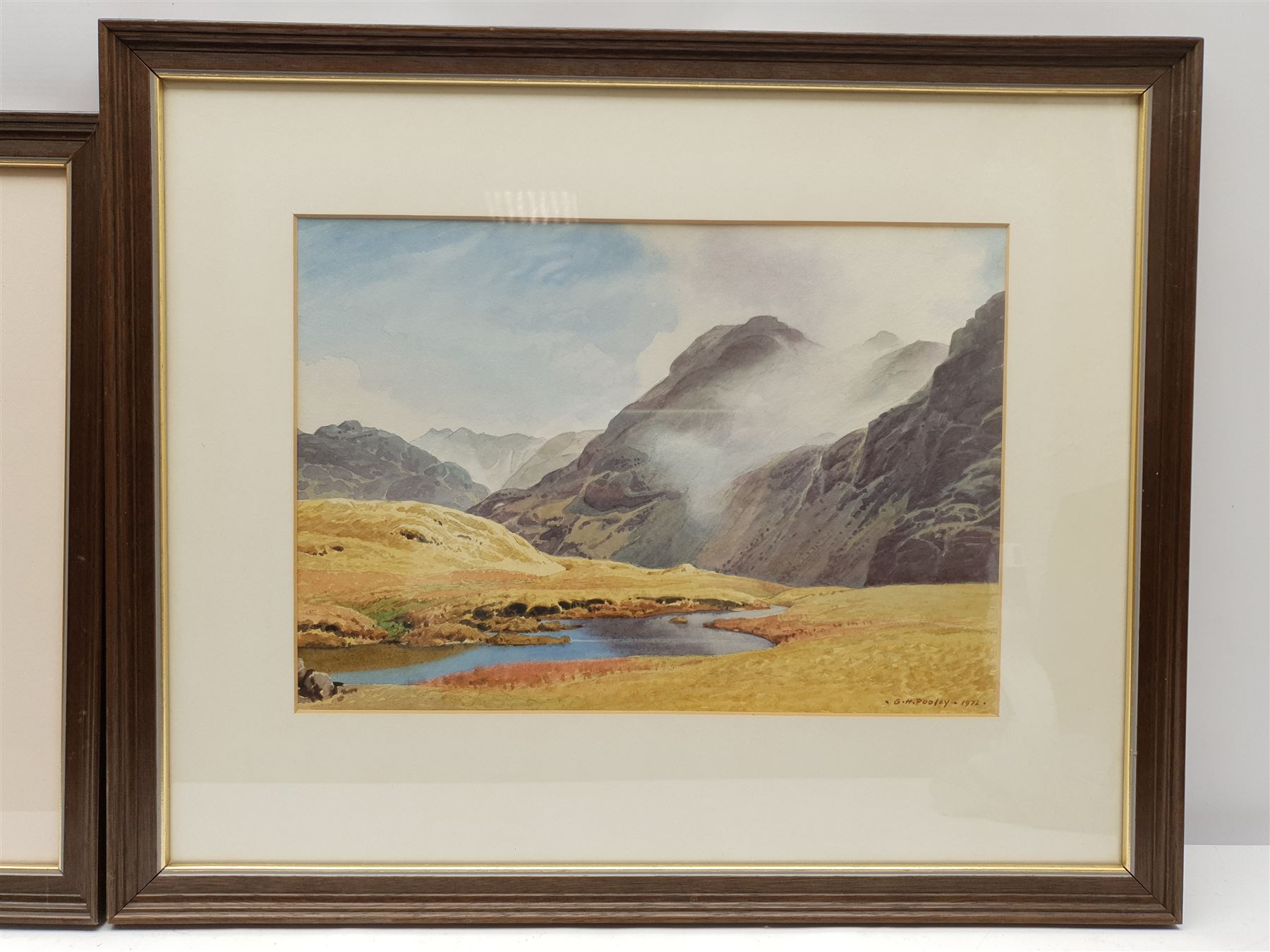 Geoffrey H Pooley (British 1908-2006): Lake District Landscapes in Summer and Winter, pair watercolours signed and dated 1972 (2)