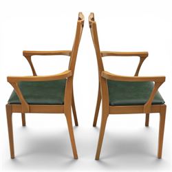 A pair of Nathan 'Highback Carvers' and a 20th century nest of teak tables, (Tables W65cm, D38cm, H49cm)
(Carvers W57, H97)
